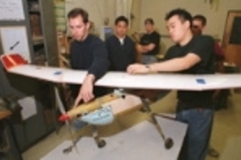 Showing off some of the Air Camel's finer features are the aircraft's designer/builders, all students in aeronautics and astronautics. Left to right: Larry Baskett, Allen Chen, Larry Pilkington, Jacob Markish (partly hidden) and Bernard Ahyou. Not pictured are Carol Cheung, Dan Benhammou and Adam Diedrich.