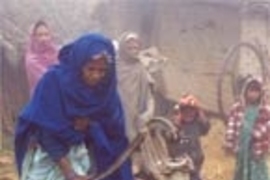 Nepali woman collects water from a tubewell.