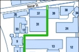 Christopher Reeve and his companions will enter the campus from Vassar Street between Buildings 37 and 39. They will park their automobile next to Building 5 and enter Building 7 at ground level. The group will take the elevator to the third floor to go to the Emma Rogers Room (10-340) for a brief respite. Then they will return to the Building 7 elevator to descend one floor to Room 10-250 where R...