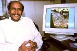 Professor Elfatih Eltahir of civil and environmental engineering sits by a monitor showing rock art of a giraffe carved thousands of years ago when portions of the Sahara were still green.
ï¿½ï¿½ï¿½ï¿½ï¿½ï¿½