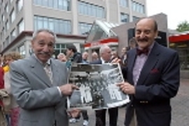 Maynard Tishman (left) and Marvin Fox point to their fathers in a photo of the F&amp;T Restaurant in Kendall Square, which was demolished in the 1980s. The fathers, Isaac Fox and Robert Tishman, opened their doors in 1924 and passed the business on to the next generation.