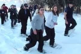 Nina Debenedictis and Breton Frazer, along with a student in the ROTC program at the University of Alaska Fairbanks, lead the rest of the MIT group as they try out snowshoes.