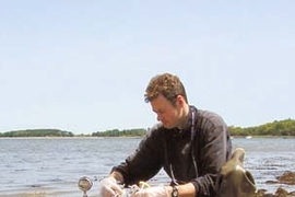 Ranier Lohmann, a former postdoctoral associate at MIT's Parsons Lab, takes samples in Boston Harbor to assess levels of toxic organic compounds.