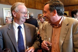 Provost Robert A. Brown, left, enjoys a surprise party held Monday, June 6, to congratulate him on his appointment to the presidency of Boston University. He is in the Emma Rogers Room chatting with Lawrence S.  Bacow, the former chancellor of MIT who now serves as president of Tufts University.