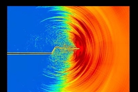 This atom-by-atom simulation shows a crack spreading through a brittle material. First the crack creates a clean slice across the surface, but as it gains speed it starts to gyrate, and the crack's path becomes increasingly uneven.