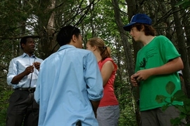 MIT visiting professor Dale Joachim, left, talks to students in a project to better listen to and learn from the natural world.