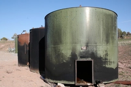 Tanks on retiree property after an explosion. Silt, Colorado. <a onclick="MM_openBrWindow('gastanks-1-enlarged.html','','width=509, height=583')">
<span onmouseover="this.className='cursorChange';">
<strong>Open image gallery</strong>
</span>
</a>
<noscript> <a href="gastanks-1-enlarged.html">
<em>(no JavaScript)</em>
</a>
</noscript>