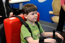 A young stroke patient tests out an MIT-developed robotic therapy device at Blythedale Children's Hospital in Westchester County, N.Y.