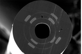 A Micrograph showing the cross-section of a new optoelectronic fiber.