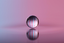 Close-ups of an experiment conducted by John Bush and his student Daniel Harris, in which a bouncing droplet of fluid was propelled across a fluid bath by waves it generated.