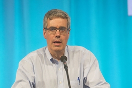 Clean Energy Prize co-founder Bill Aulet, co-director of the Martin Trust Center for MIT Entrepreneurship, addresses the crowd in the Kresge Auditorium. 