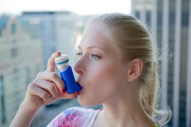 Person using an inhaler