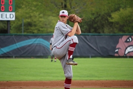 Senior David Hesslink pitches against Babson College in Babson Park, Massachusetts during game one of the NEWMAC Championship Series on May 6, 2017.