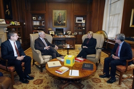 The president of Croatia, Kolinda Grabar-Kitarović, visited MIT on Monday, Dec. 4. From left: MIT President L. Rafael Reif; MIT physicist Marin Soljačić, receiving an award the Croatian president, Kolinda Grabar-Kitarović; and the Dean of the MIT School of Science, Michael Sipser.
