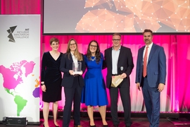 Members of Reaktor Education, which uses online courses to teach people about artificial intelligence, pose with IIC organizers and sponsors after winning the $250,000 grand prize in the skills development and opportunity matching category.