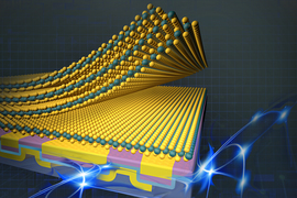 Layers of 2D materials are represented by yellow and green grids made of balls. They are on top of a yellow and pink rectangular structure, and bursts of blue light emanate.