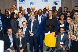 A group photo with Kornbluth, Masisi, and about 30 conference participants.