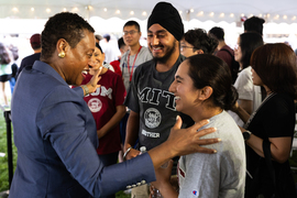 Melissa Nobles greeting a female student and her family