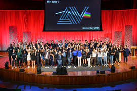 The full group of presenters on stage