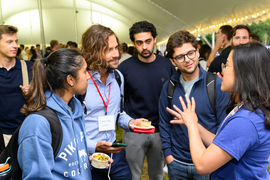 Attendees talking during a reception