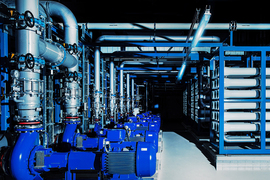 Rows of pipes and gauges inside a water treatment plant