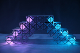 A pyramid-shaped staircase made of voxels. Voxels are hollow but form a lattice.